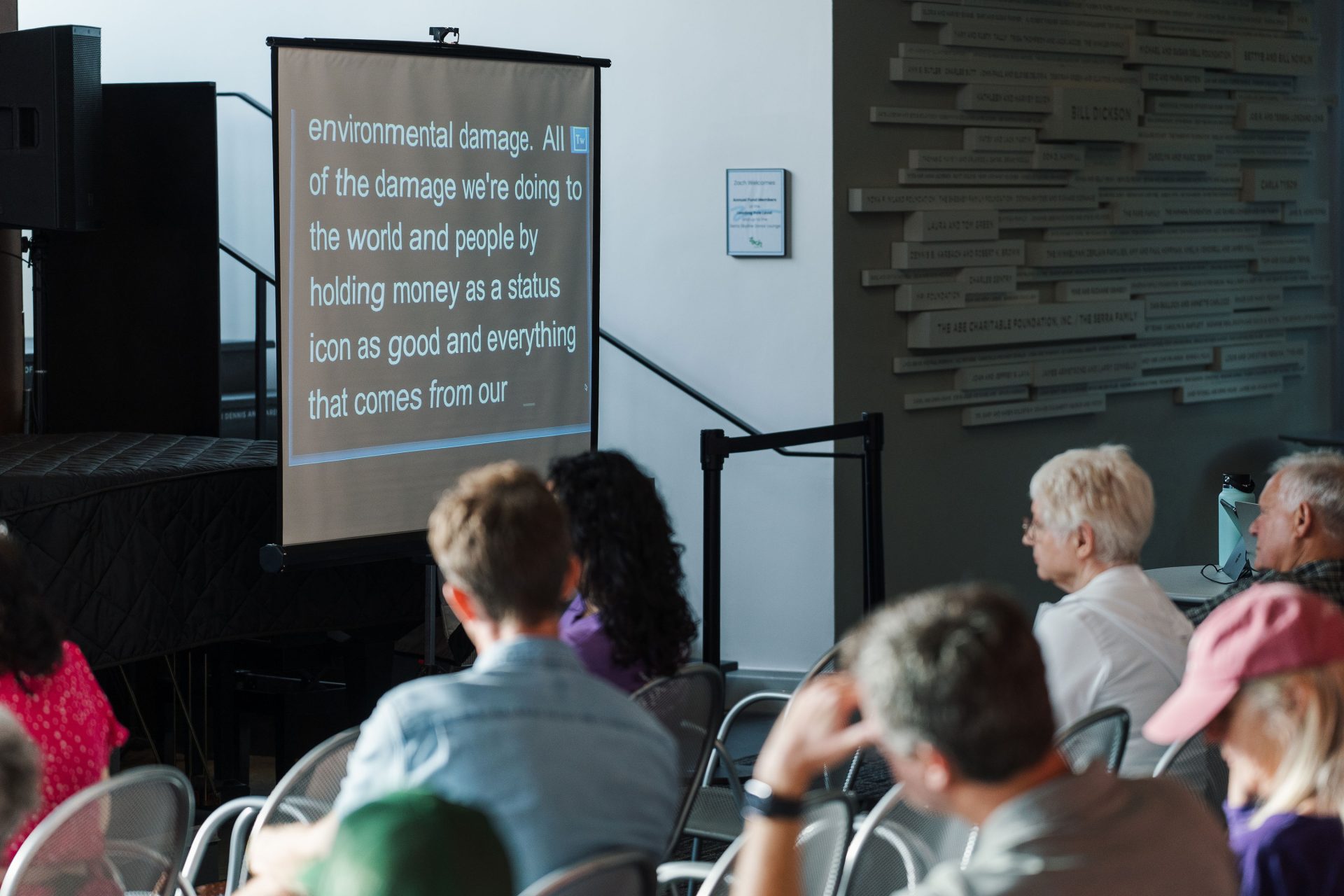 captioning screen and audience members