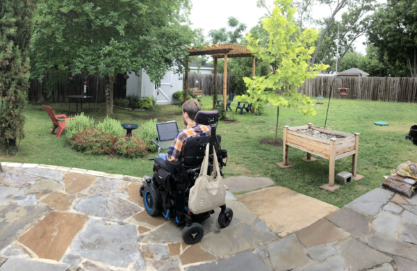 Photo of man in wheelchair outside