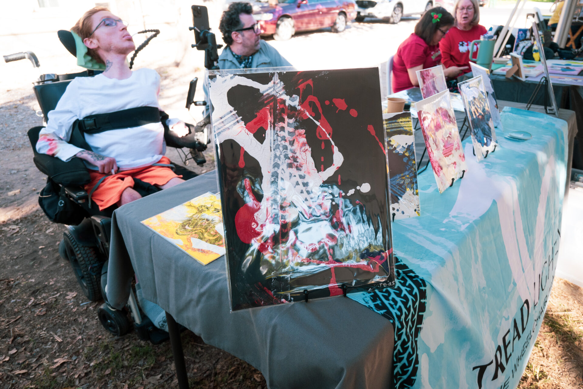 Jonah Dillon pops up with paintings created with the power wheels of his wheelchair - at Art Spark Texas' Beyond Art Market in December 2025