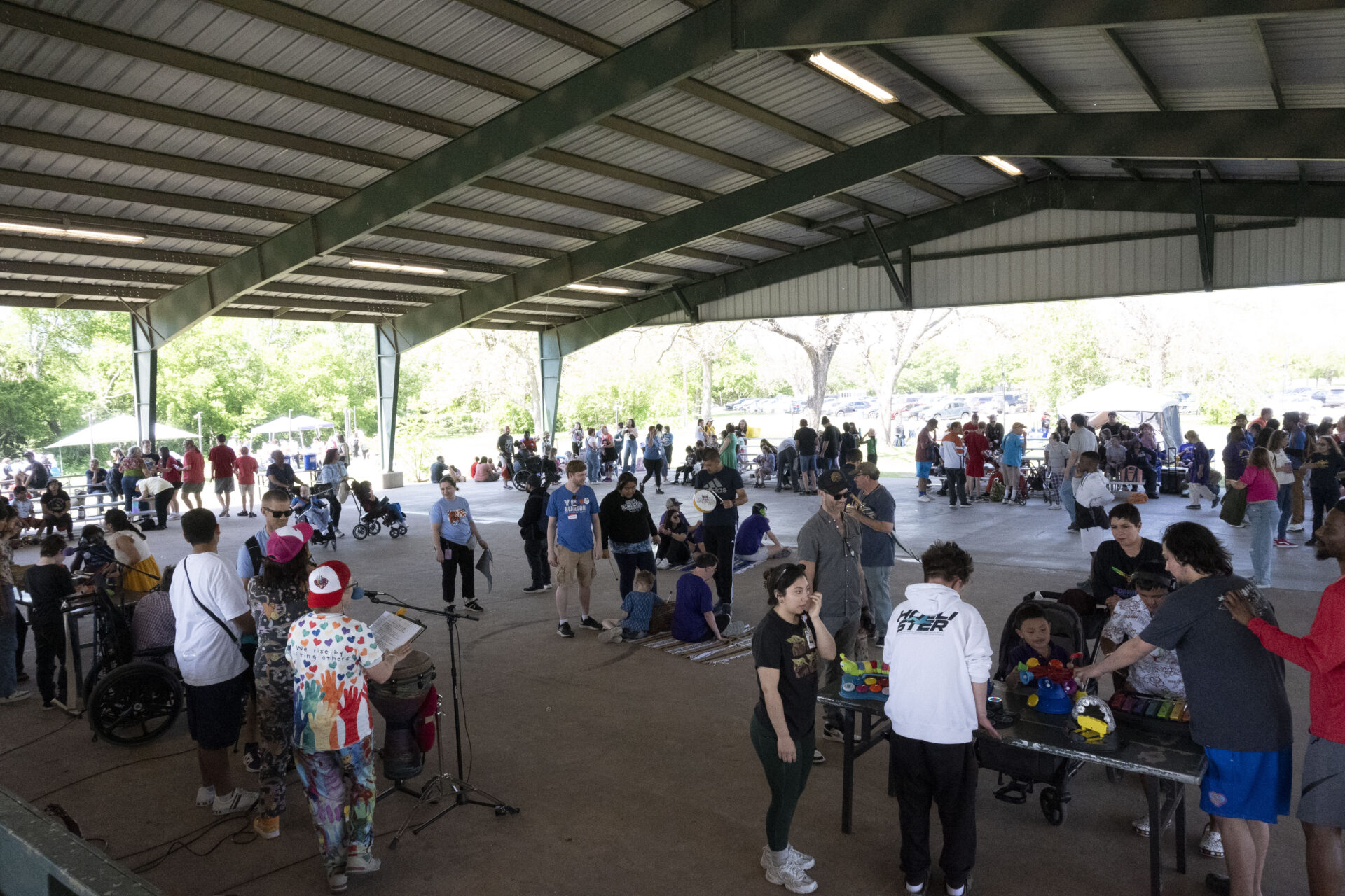 Fiesta Gardens Pavilion full of performers and guests for Art Spark Texas' Art in the Park last month (April 2025)
