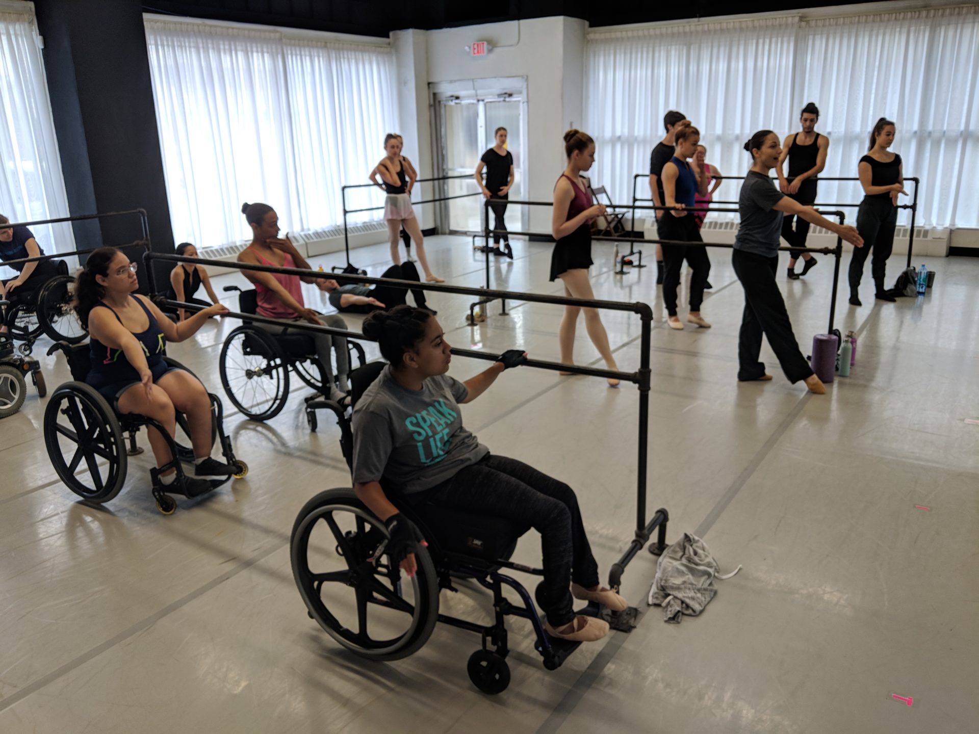 Dancers with and without disabilities in a ballet class.