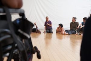 DanceAbility co-founder and artistic director Alito Alessi (center) begins the session with all attendees in a circle for a moment of silence, so that all participants, regardless of their abilities, begin the class in the same state of being.Photo: Kelly Sullivan
