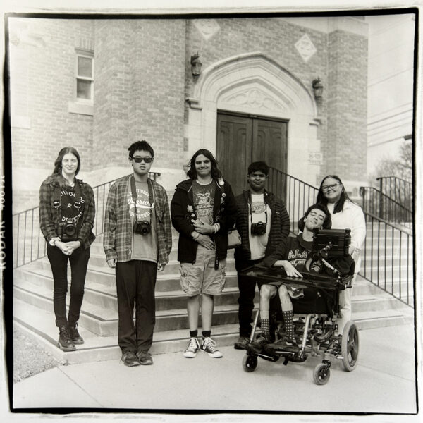 Black and White photo of interns, one of which uses a wheelchair.