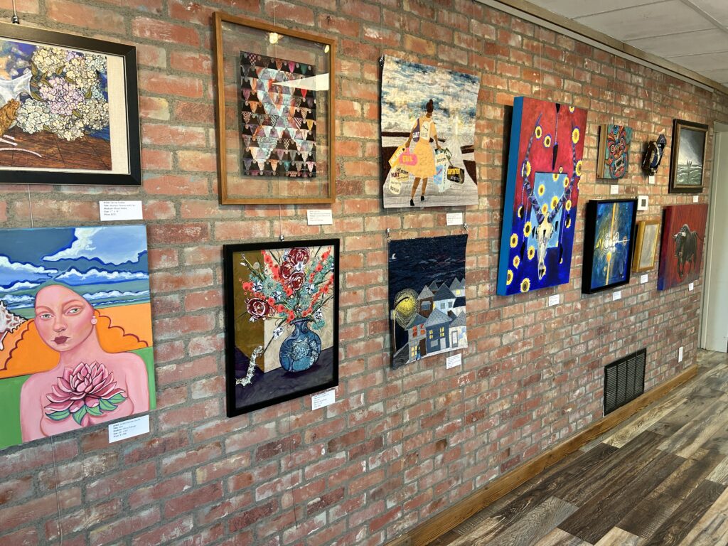 Gallery wall at the 16th Annual Distinguished Artist Veterans Exhibit at the Williamson County Art Guild Gallery in Georgetown, Texas from Art Spark Texas