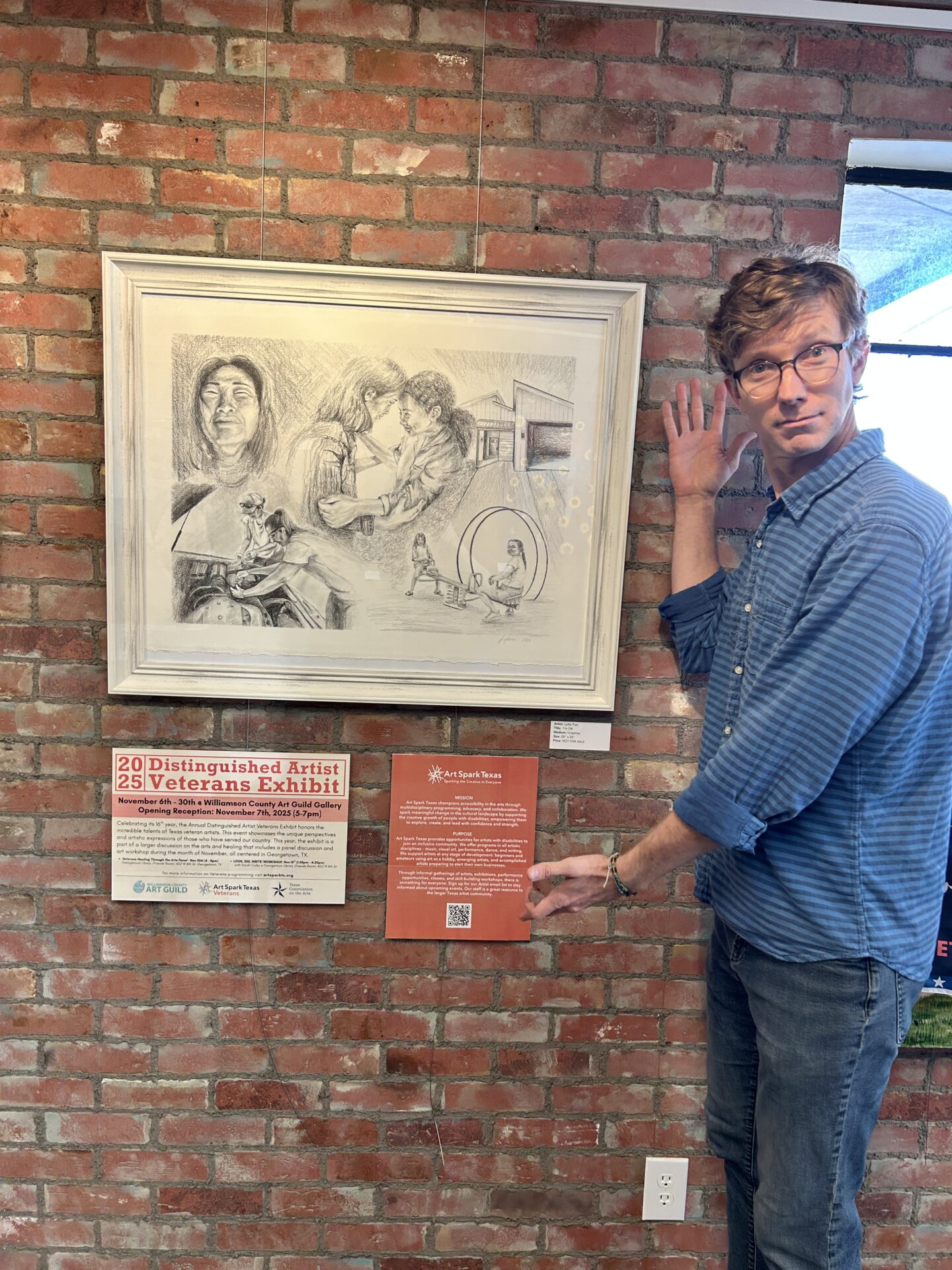 Jerry Slayton poses in front of Art Spark Texas signage for the 16th Annual Distinguished Artist Veterans Exhibit at the Williamson County Art Guild Gallery in Georgetown Texas for Veteran's Month 2025