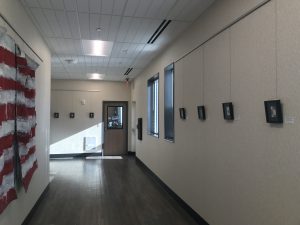 Hallway with artwork on display at Austin Lighthouse
