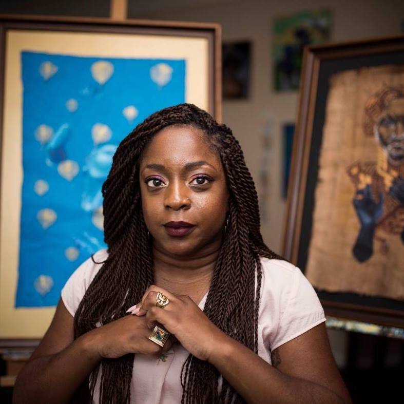 Kemi Yemi-Ese standing in front of her artwork.