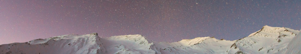 Photograph of a snow-covered mountain range