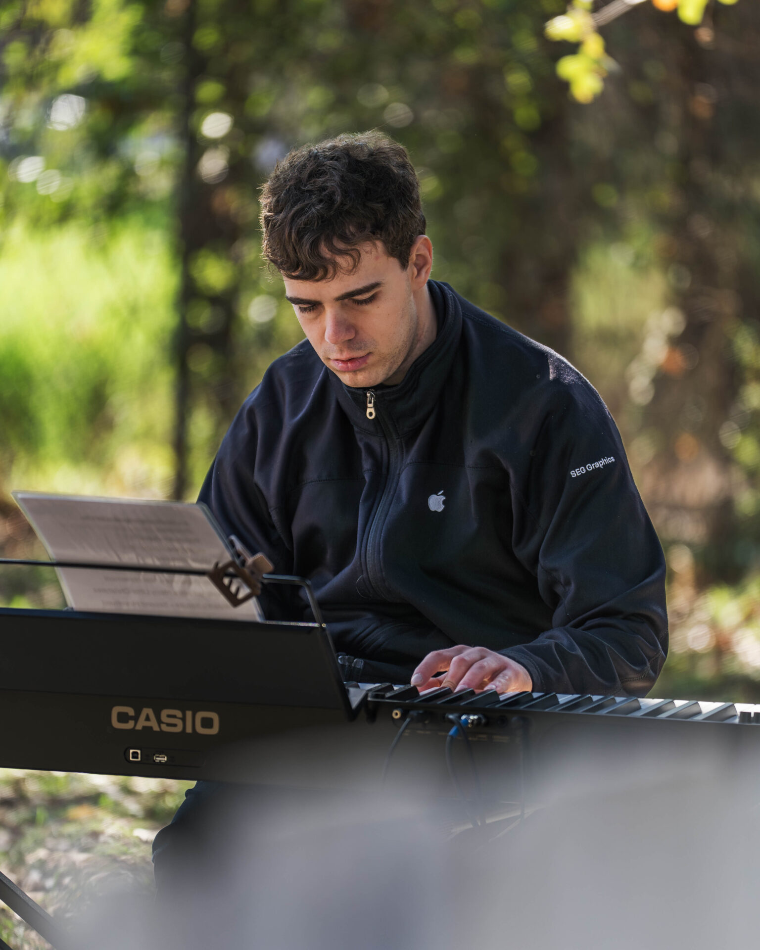Zachary LaViola plays beautiful Christmas tunes on the piano for Beyond Art Market at Art Spark Texas
