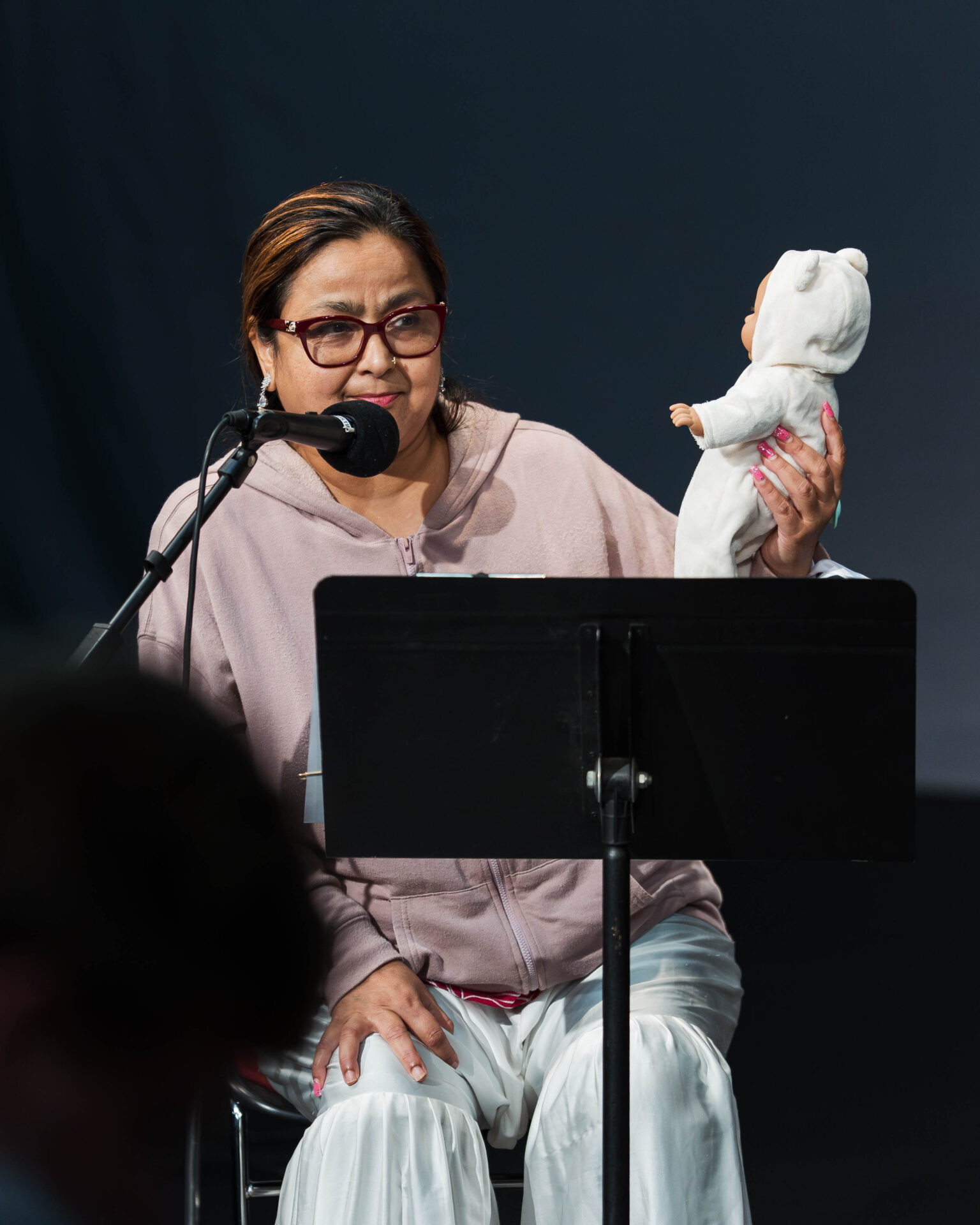 Speaking Advocates participant shares their story at the public showcase from Art Spark Texas