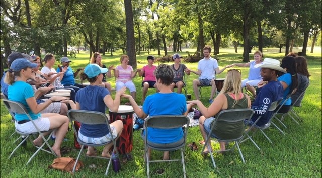 People in a drum circle.