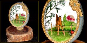 On the left, a Duck eggshell decorated with micro miniature 3-D diorama of a colt horse at the fence. On the right, a close-up detail of the horse and straw fence. Designed and made by Ruth McIntosh.