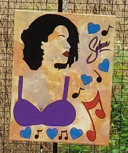a painting of the musician Selena with music notes and hearts.