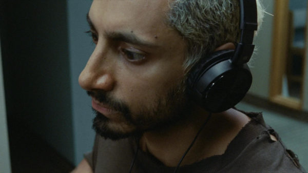Photo of man wearing headphones.