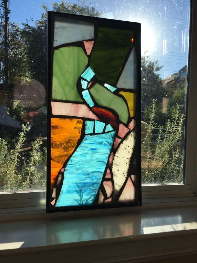 Stained Glass leaning against window