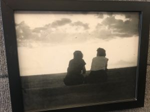 photo of two women watching the sunset
