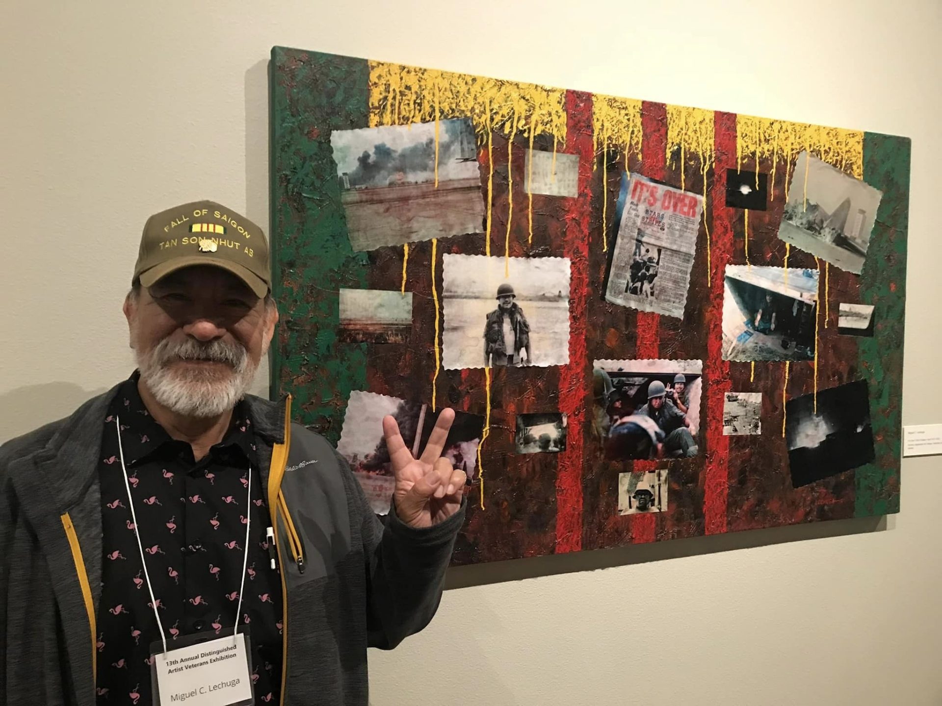 Veteran stands beside his painting at last years show