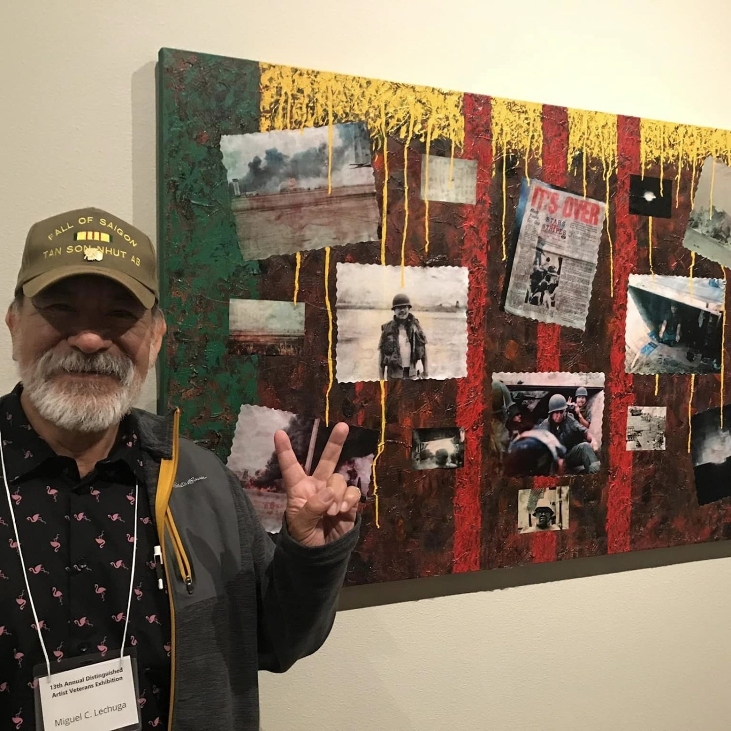 Veteran stands beside his painting at last years show