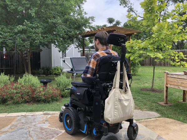 photo of man in wheelchair in backyard
