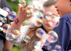 girl playing with buggles