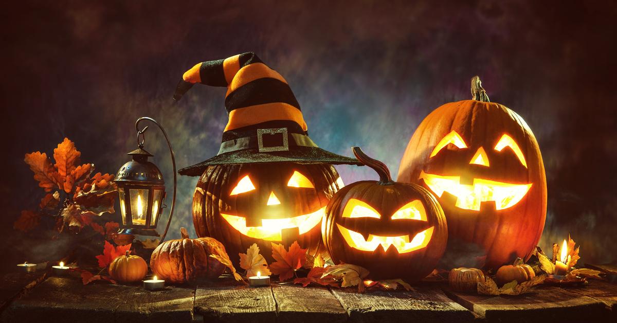 Computer-generated image of three jack-o'-lanterns, one wearing an orange and black witches hat