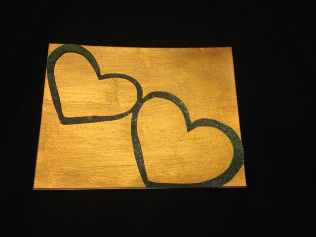 Cardstock of two hearts with gold background