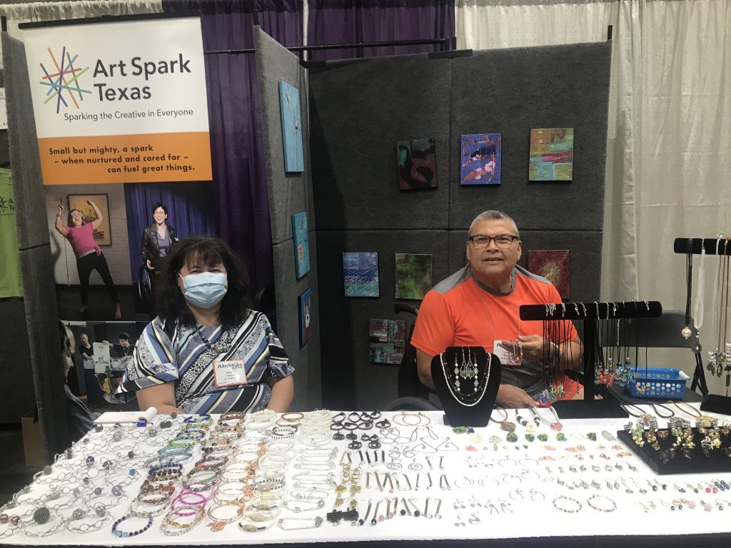 Two vendors selling jewelry at the abilities expo.