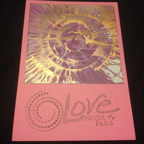 acrylic paint & ink stamp on card stock - "Love never fails"