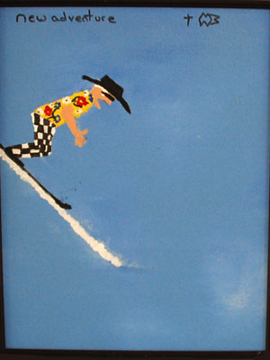 Man in a brightly colored shirt snow skiing