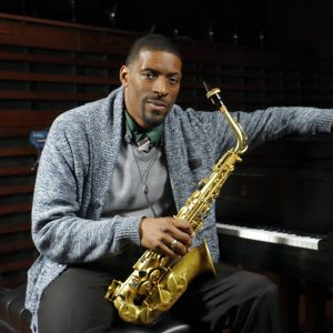 quamon poses with saxophone