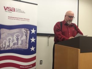 Veteran speaking at podium during event