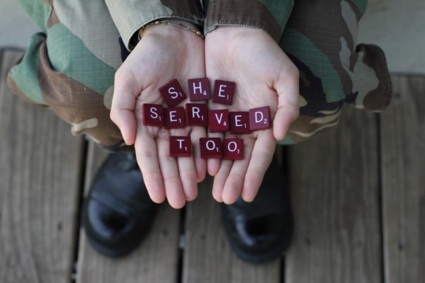 scrabble tiles spelling "she served too"